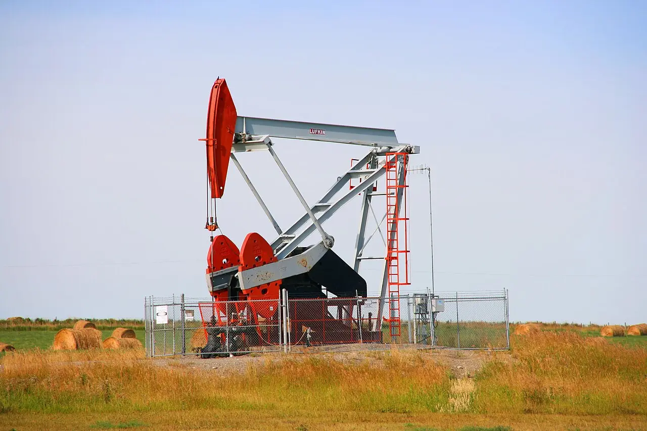 A pumpjack on an Alberta oil lease in autumn