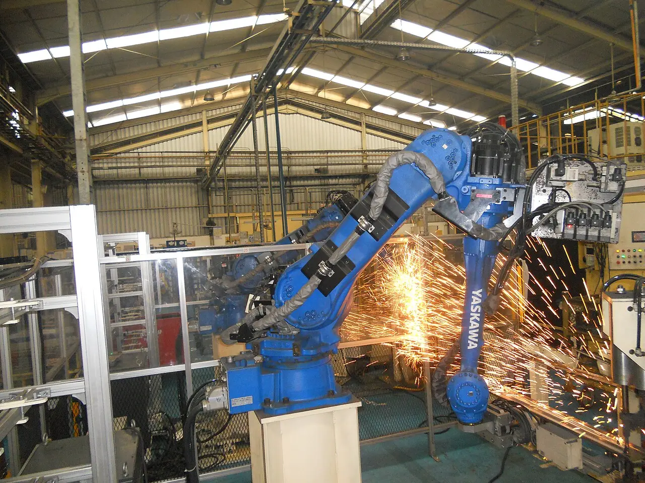 A robotic arm welding in a factory